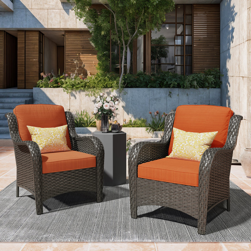 Chaise de patio en rotin avec coussins Guillen, Coussin orange / cadre brun
