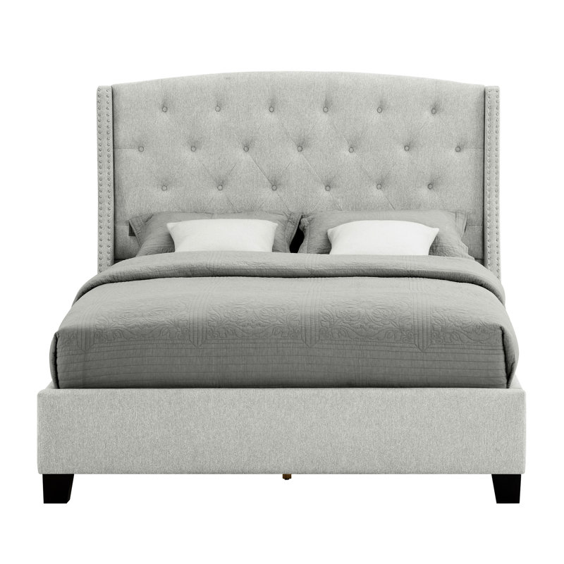 Lit double capitonné en tissu gris avec tête de lit à oreilles et tête de lit