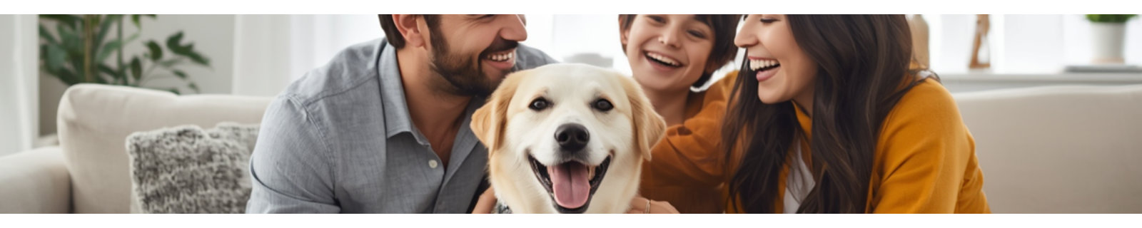 Family smiling with a dog