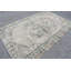 Tapis turc rétro dans des couleurs pastel douces avec un design géométrique pour un décor et un style uniques
