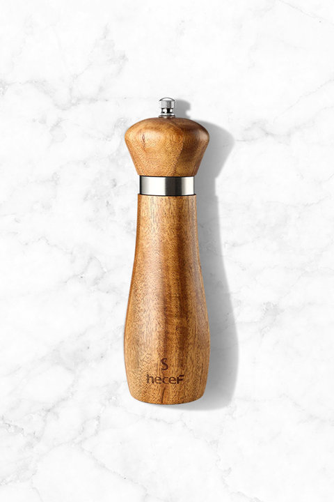 Hecef wooden salt and pepper mill with stainless steel accents on a white marble background.