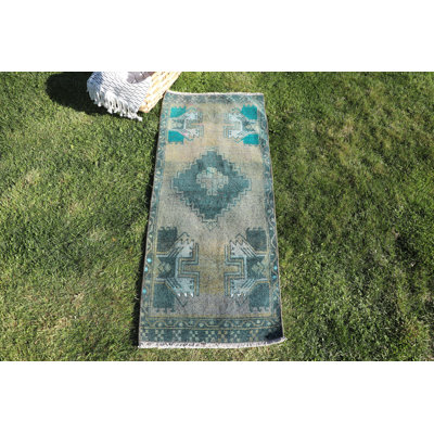 Petit tapis turc rétro vert avec motifs tribaux colorés pour le décor de la chambre à coucher