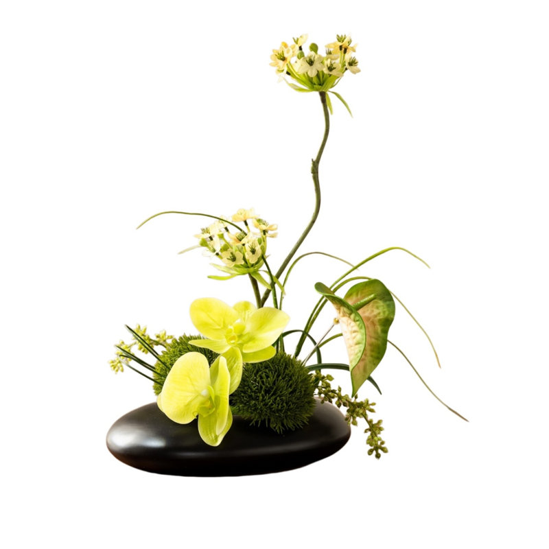 Composition florale d'orchidées jaunes artificielles, centre de table de fleurs artificielles avec vase en forme de galet noir, feuillage et mousse mélangés