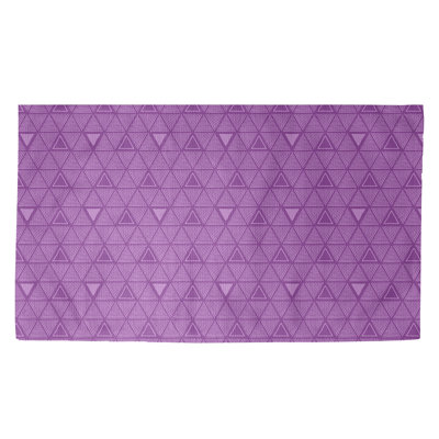 Tapis mauve à motif de triangles