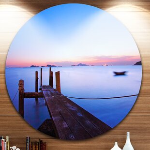 Designart 'Rusty Row Boat on Sand at Sunset' Seascape Large Disc Metal Wall Art