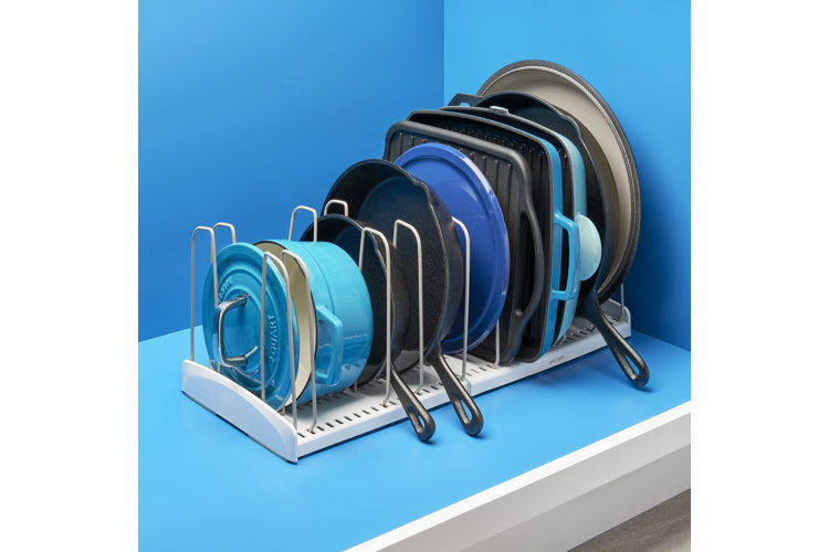 pots and pans organized in a countertop organizer