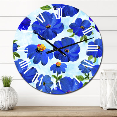 Horloge murale abstraite à fleurs bleues sur fond bleu clair
