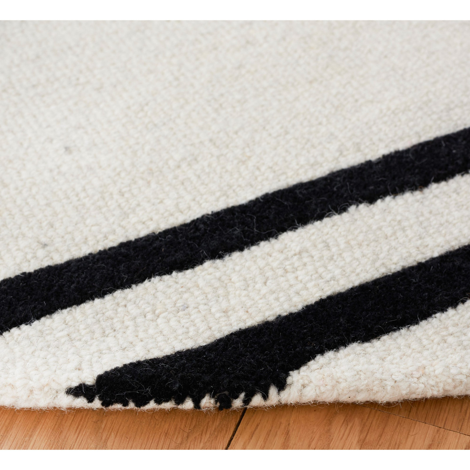 Felipe Ivory Black Hand-Woven Abstract Wool Rug, Round 8'