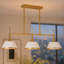 Suspension Nolia à 3 lumières, 87,6 cm (34,5 po) de largeur, à intensité variable, de forme conique linéaire.