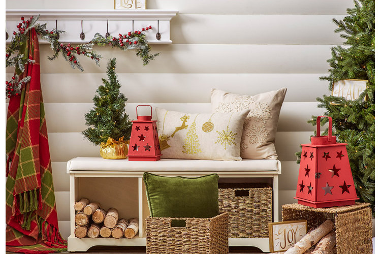 dresser decorated with an array of wreaths, garlands and miscellaneous christmas decorations