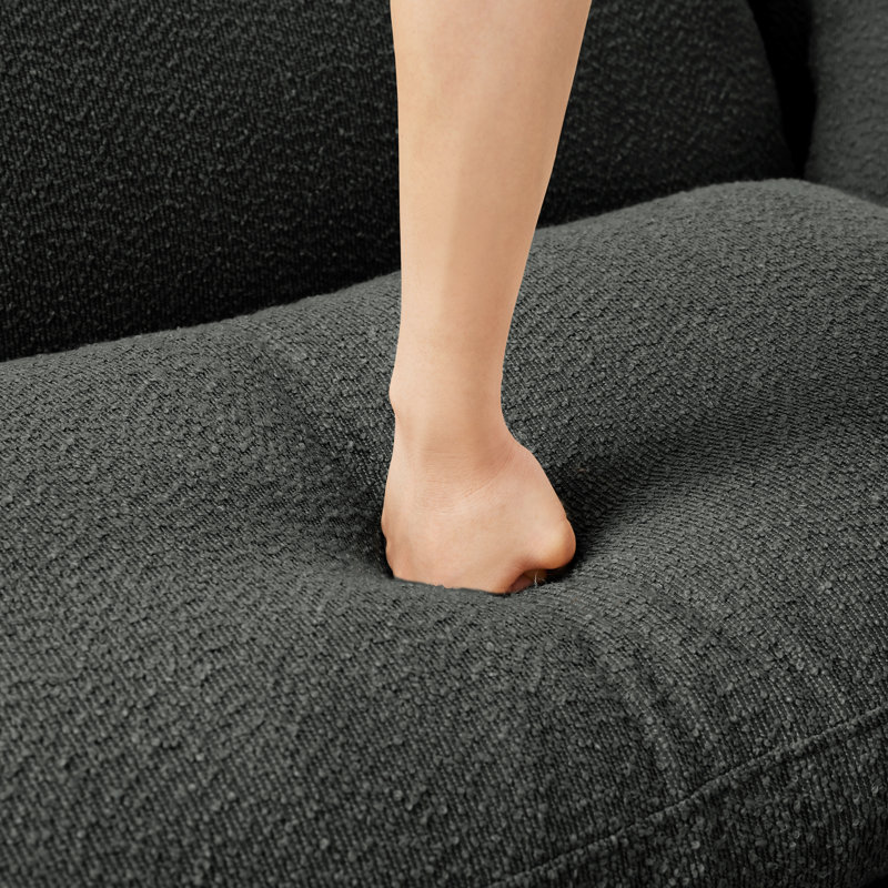 Gris foncé avec un look moderne, des pieds cylindriques et des coussins à ressorts