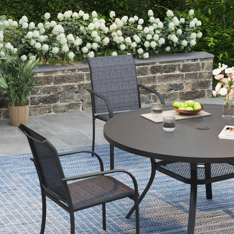 Ensemble de salle à manger de patio pour 4 personnes avec chaises empilables PVC-coated polyester, Noir / Noir
