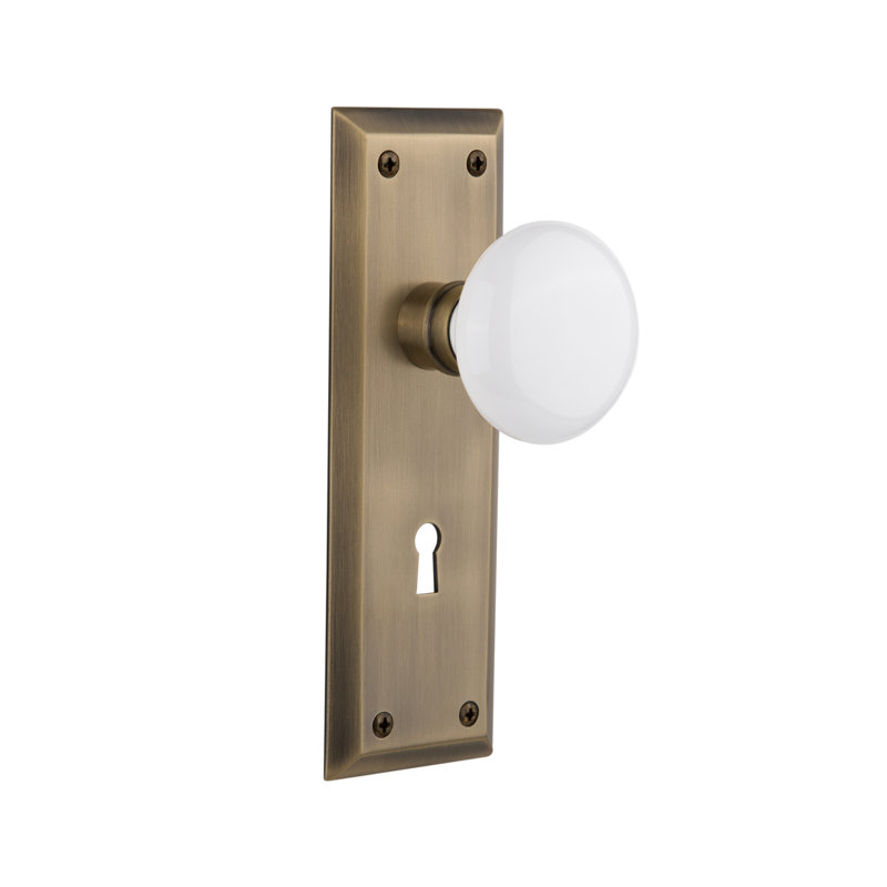 New York Plate with Decorative Keyhole and White Porcelain Door Knob, Antique Brass, 2-3/4”