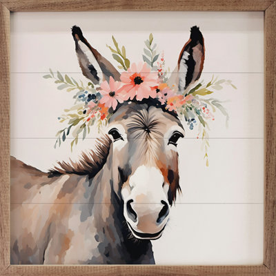 Âne avec couronne de fleurs blanche