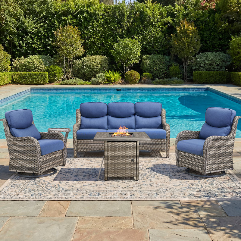 Amaris 7-Piece Outdoor Wicker Patio Conversation Set With Fire Pit Table, Swivel Gliders And Ottomans, Gray, Blue
