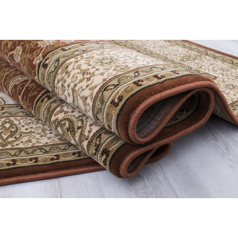 Harpersville Oriental Area Rug in Brown/Ivory
