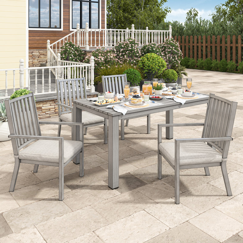 Deidre 4 - Person Patio Dining Set with Rectangular Table , Cushions Included, Gray