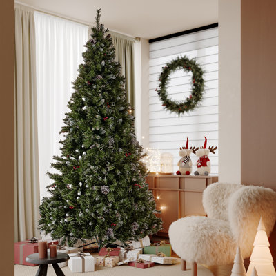 Arbre de Noël à poils scintillants avec baies rouges et pommes de pin
