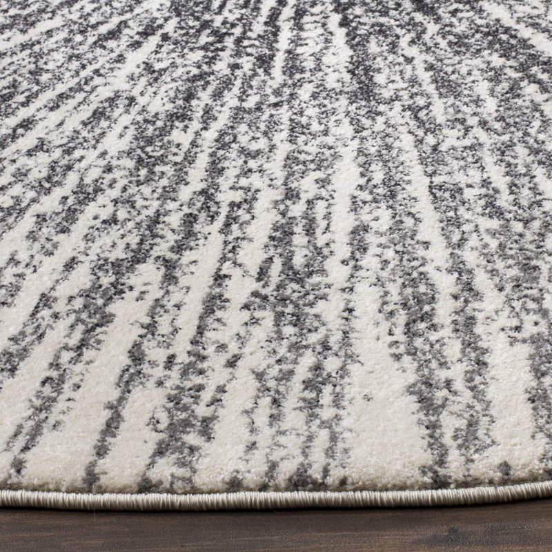 Tapis noir et ivoire à motif abstrait, Rond 3 pi