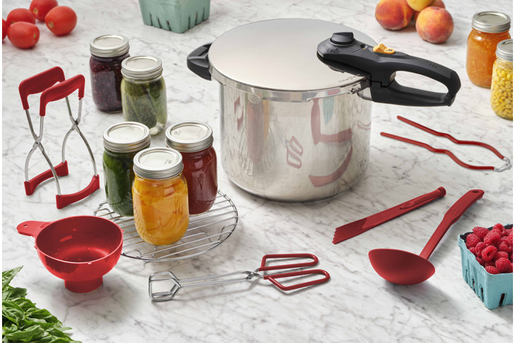 pressure canner with canning supplies around