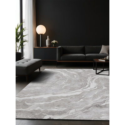 Tapis gris soyeux et moelleux