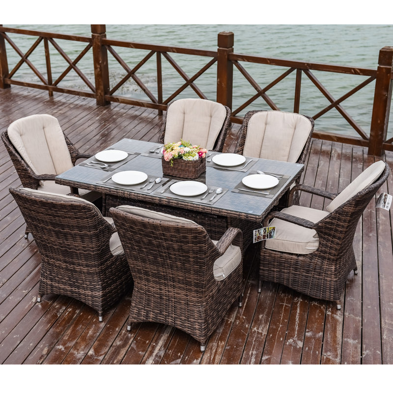 Algird 6 - Person Wicker Patio Dining Set with Rectangular Table , Cushions Included, Brown Frame/Beige Cushion