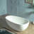 WOODBRIDGE 59" Egg-Shaped Solid Surface Freestanding Soaking Tub, Modern Oval Stone Resin Bathtub with Integrated Slotted Overflow & Drain, Matte White