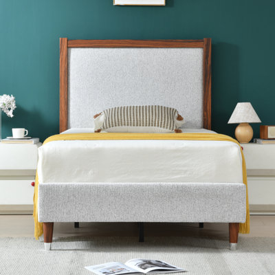 Wooden platform bed with upholstered base