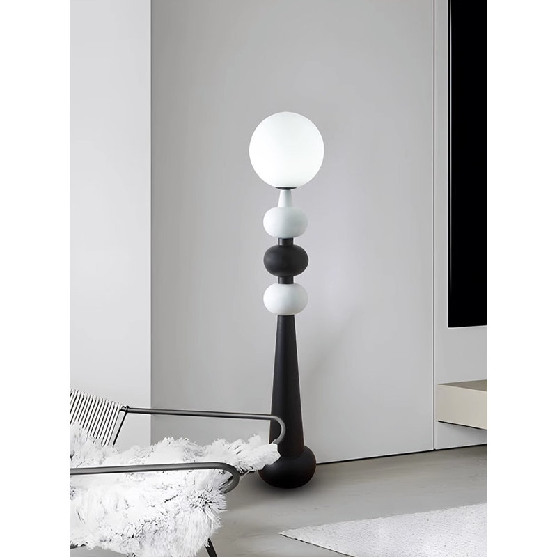 Simple and Modern Floor Lamp with Glass and Wrought Iron Elements.