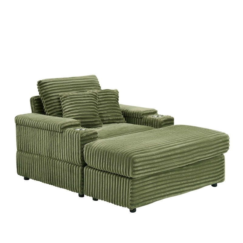 Canapé simple en velours côtelé vert avec un coussin, deux coussins décoratifs, un repose-pieds et deux espaces de rangement