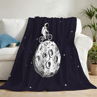 Jeté transparent en flanelle molletonnée ultra douce, imprimé mignon d'un seul astronaute à bicyclette