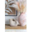 JardiniÃ¨re en forme de coquille de nautile aux finitions dÃ©taillÃ©es et Ã  la texture beige, idÃ©ale pour une dÃ©coration de style cÃ´tier et pour accueillir toutes sortes de plantes