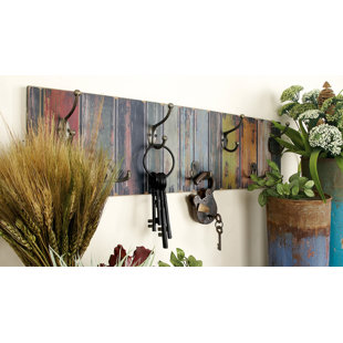 https://assets.wfcdn.com/im/72811214/resize-h310-w310%5Ecompr-r85/4434/44347542/freida-7-hook-wall-mounted-coat-rack.jpg