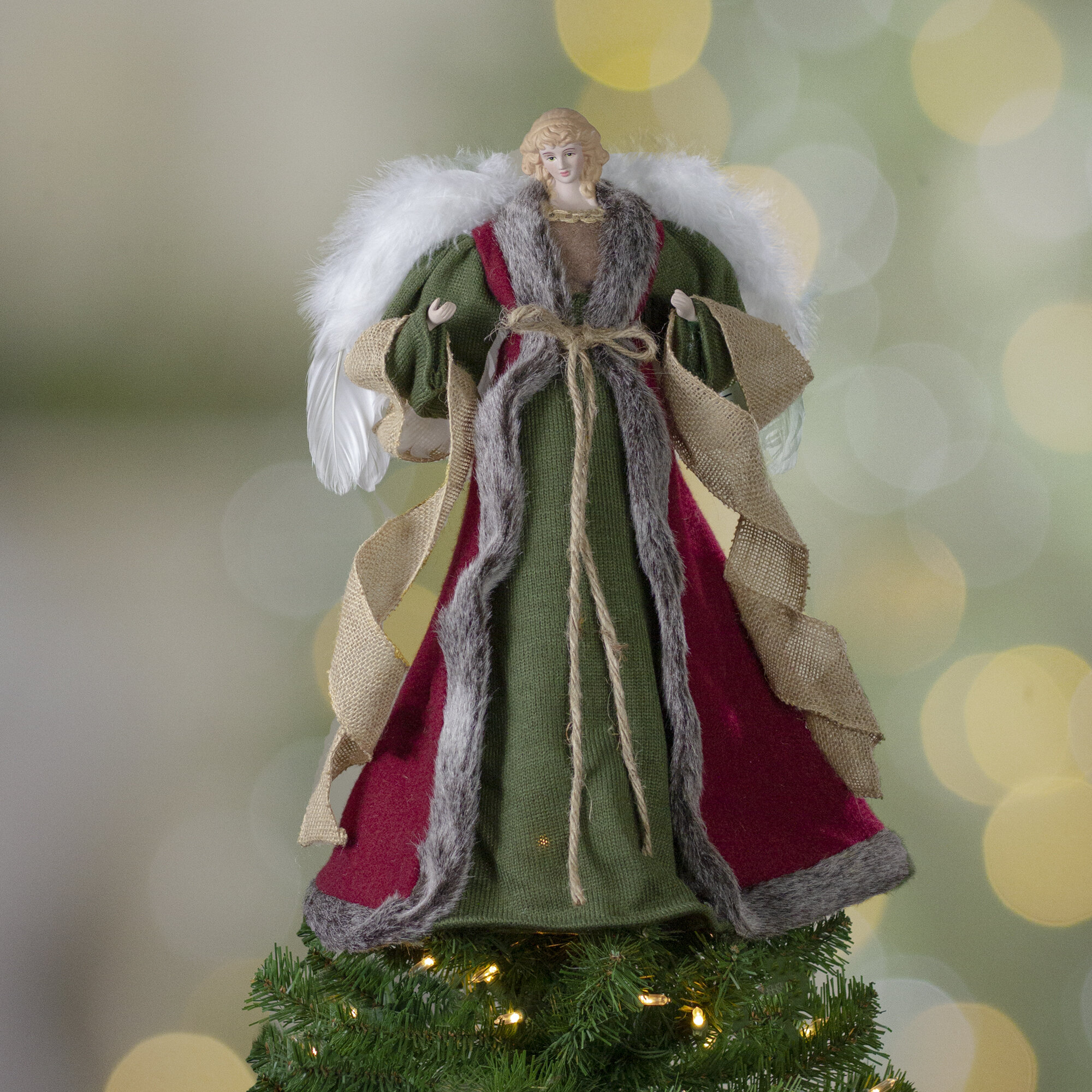 https://assets.wfcdn.com/im/72821677/compr-r85/1656/165665998/18-green-and-brown-angel-in-a-dress-christmas-tree-topper-unlit.jpg