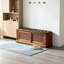 Banc à chaussures long en bois massif brun avec portes coulissantes en rotin et siège rembourré-740677088