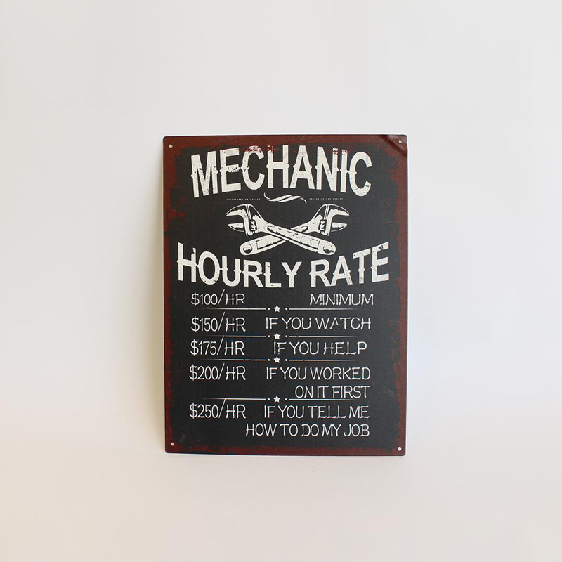 Tableau des taux de mécanicien avec panneau humoristique
