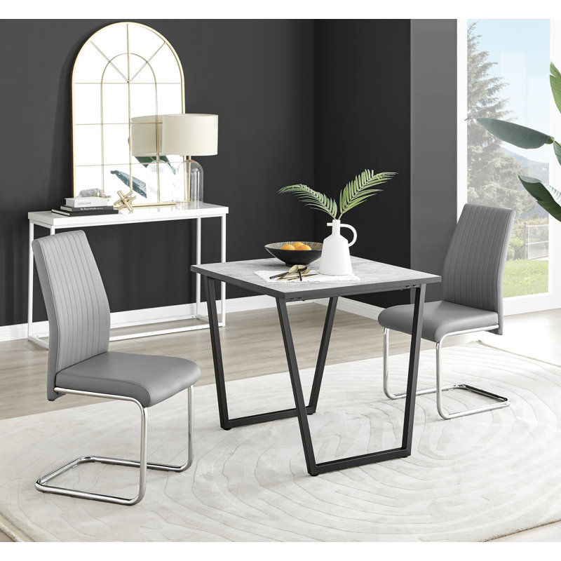 Table de salle à manger et chaises en mélamine effet marbre Carzon - Chaises de salle à manger en similicuir de luxe