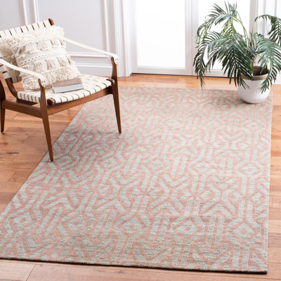 Tapis géométrique bleu / rouille en jute tissé à la main Laumer