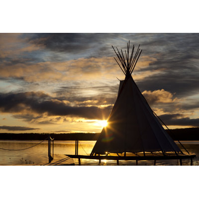 Teepee On A Sunset by Buzzanimation - Wrapped Canvas Print