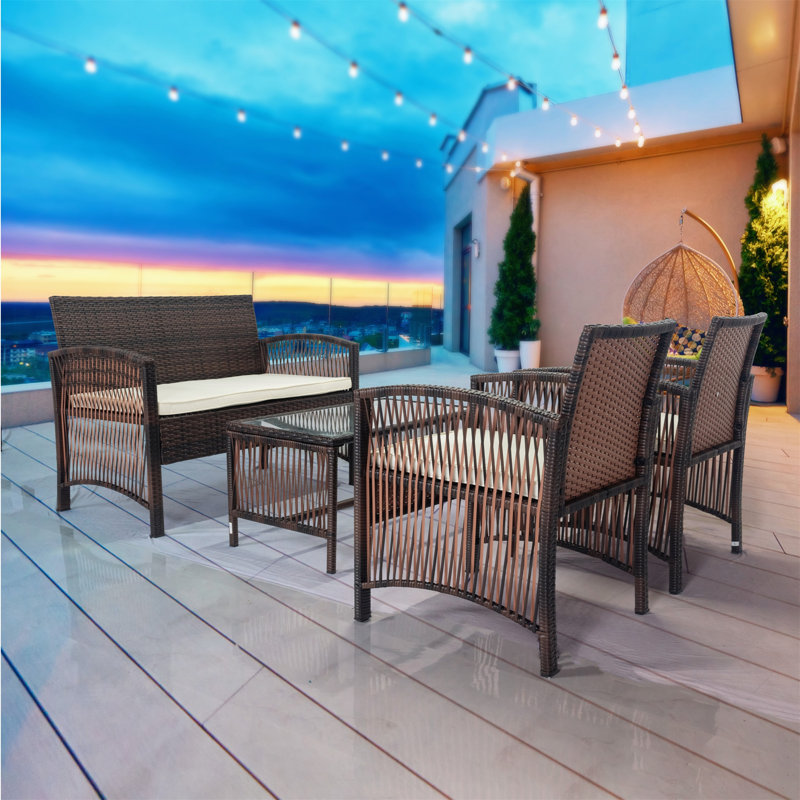 Rowes 4 - Person Patio Dining Set with Rectangular Table , Cushions Included