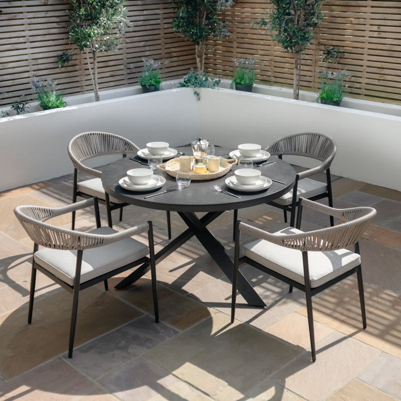 Brecon 4 - Person Patio Dining Set Round Table with Cushions Included