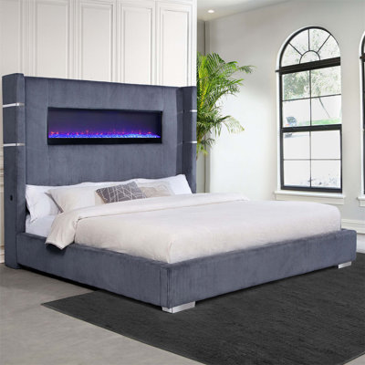 Luxueux lit très grand tapissier de style oriental gris avec visualisation de flamme intégrée et télécommande, parfait pour les chambres à coucher modernes.