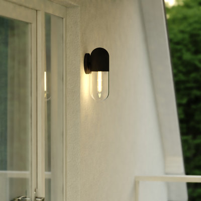 Synclaire 12.5 in. H 1-Light Matte Black Contemporary Outdoor Wall Sconce made of Durable Metal, Clear Glass Shade, LED Compatible, Use for Exterior Porch Patio Front Door or Garage