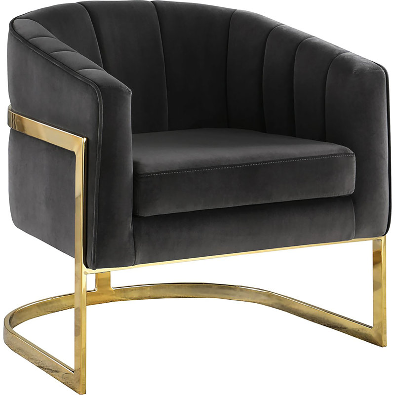 Chaise en velours gris foncé, structure élégante au design doré, caractéristique audacieuse