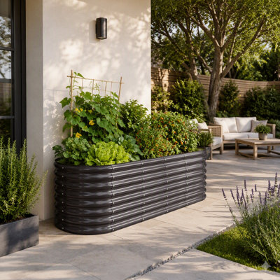 Jardinière ovale surélevée en métal galvanisé de 2,4 x 0,6 x 0,6 m (8 x 2 x 2 pi) avec fond ouvert pour légumes, fleurs et herbes aromatiques d'extérieur.