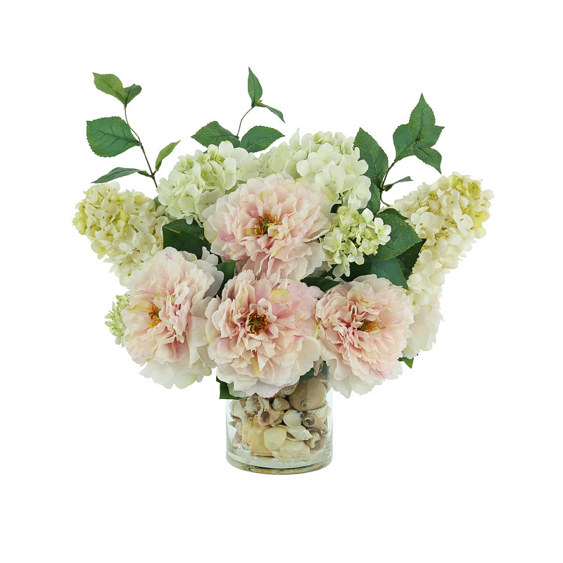 Peony and Hydrangea Arrangement in a Clear Glass Pot with Seashell