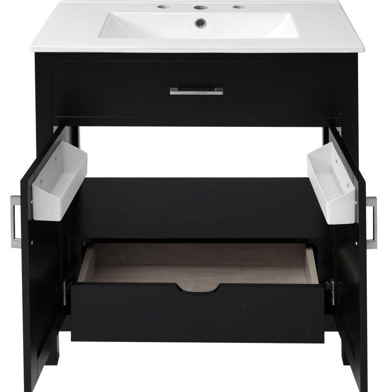 Meuble-lavabo noir de 30 pouces avec lavabo en céramique et nombreux espaces de rangement. Fabriqué en bois massif. Offre des tiroirs pratiques. Finition moderne pour une unité. Fonction de fermeture en douceur