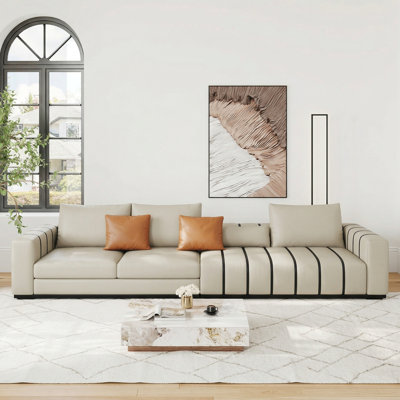  Wrought Studio™ 118" Modern Oversized Cream Faux Leather Sofa with Black Striped Details and Toss Pillows