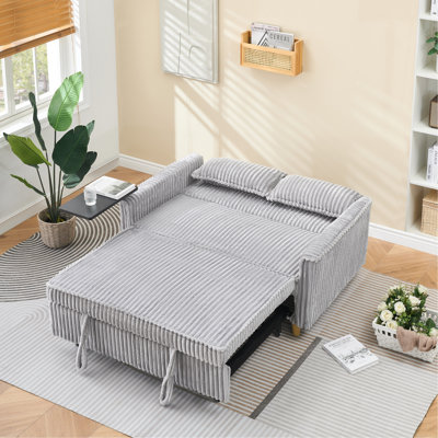 Le canapé coulissant en velours côtelé gris avec fonctions doubles, équipé d'un plateau de table mobile et de ports USB, convient aux salons et aux chambres à coucher.