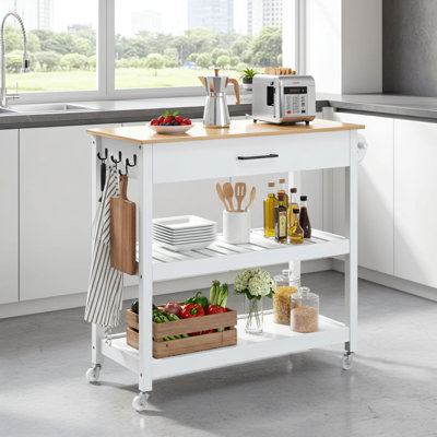 Chariot d'îlot de cuisine à roulettes blanc avec tiroirs, porte-serviettes amovible et 3 crochets. Un chariot de rangement flexible pour les cuisines domestiques.